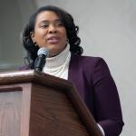 Ashley Smith speaking at podium
